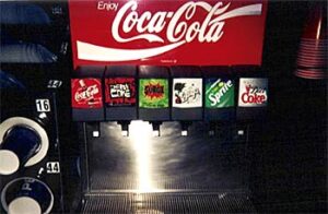 A soda fountain with SURGE in the middle.